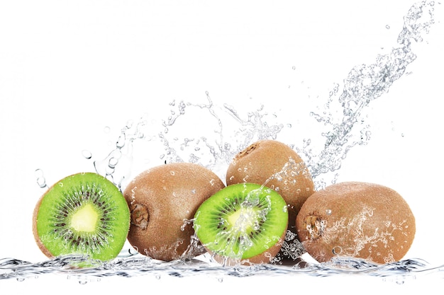 Fresh kiwi falling in water