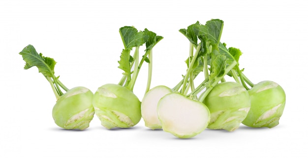 Fresh kohlrabi with green leaves on isolated white backround