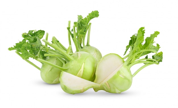 Fresh kohlrabi with green leaves on isolated white