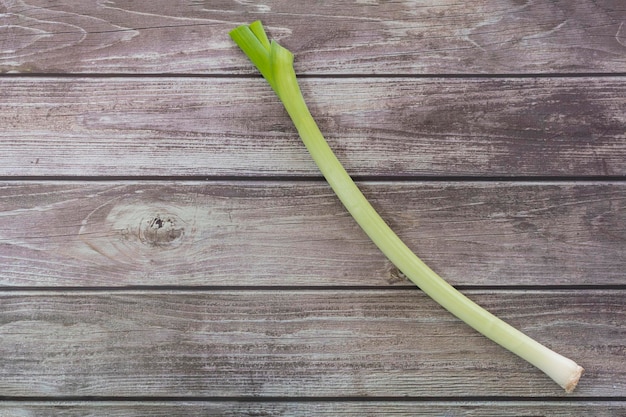 Fresh Leek on wooden table