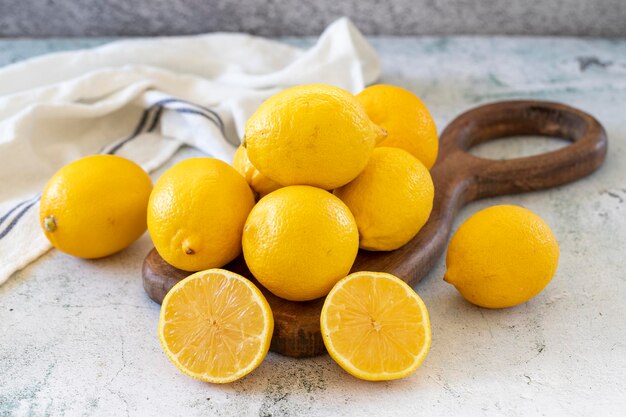 Fresh lemon Half cut lemon on stone background close up