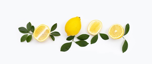 Fresh lemon with green leaves on white background.