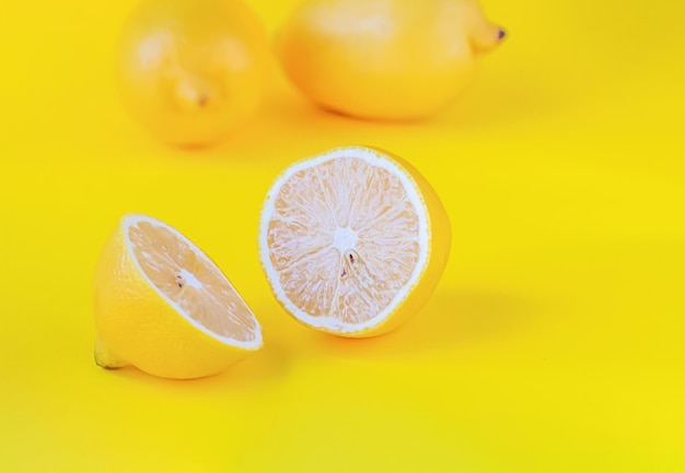 Fresh lemon on yellow background.