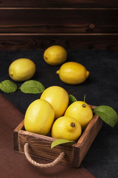 fresh lemons in a wooden box