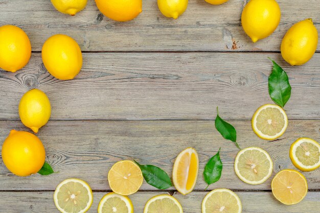 fresh lemons on wooden table.