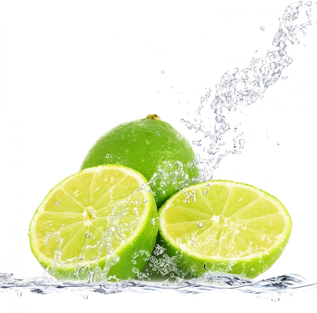 Fresh lime falling in water