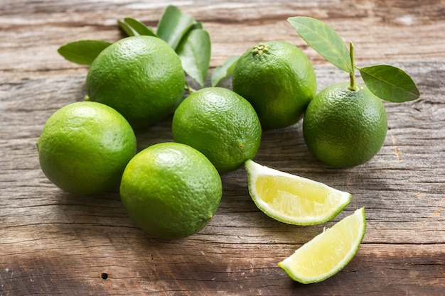 Fresh lime. Food ingredient. Slice lime on wooden background.