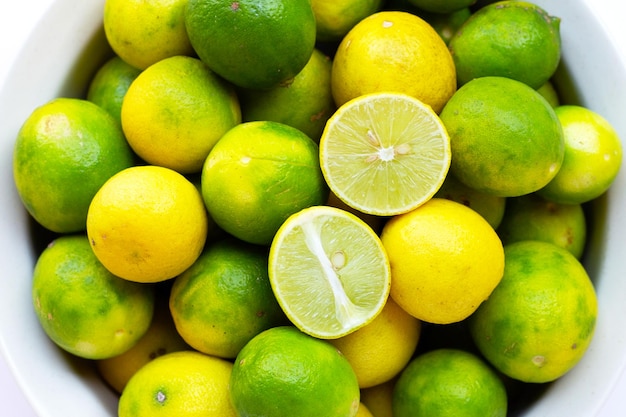 Fresh limes in white bowl