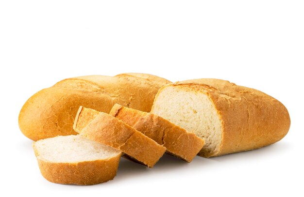 Fresh loaves of bread sliced in close-up on white