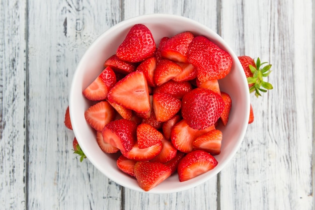 Fresh made Sliced Strawberries on a rustic background