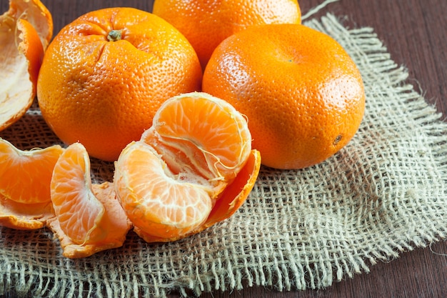 Fresh mandarines on wooden table