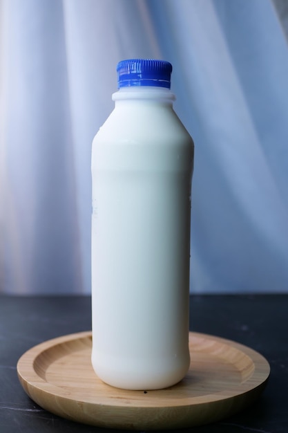 Fresh milk in a plastic bottle on table