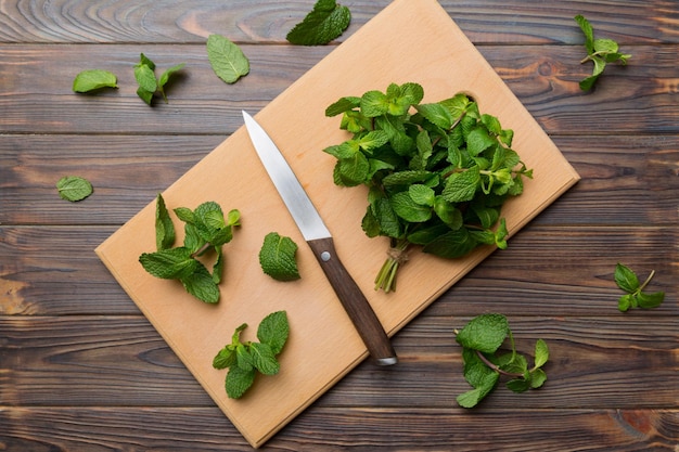 Fresh mint on Cutting board table top view Flat lay Space for text