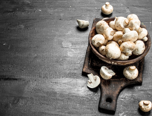 Fresh mushrooms on the board.