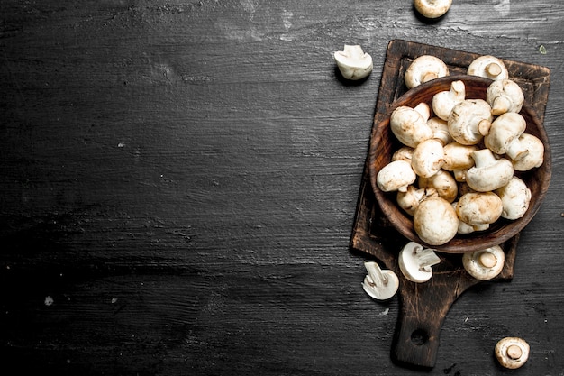 Fresh mushrooms on the board.