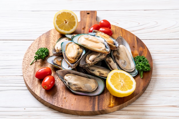 fresh mussel on wood board