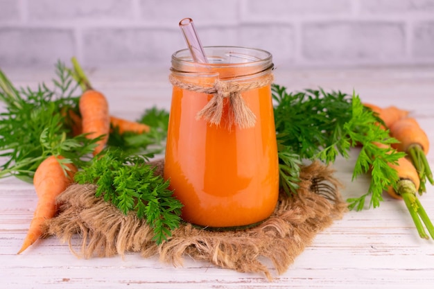 Fresh natural carrot juice in a jar. Healthy food concept.