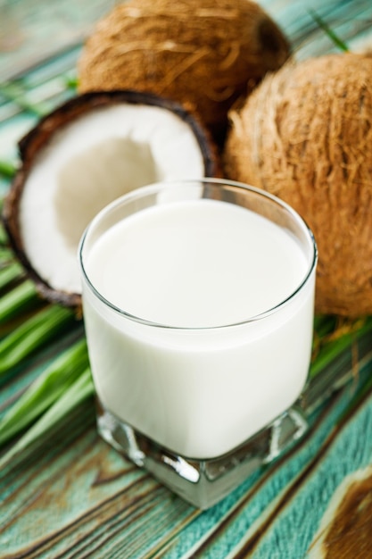 fresh natural coconut milk on wooden background