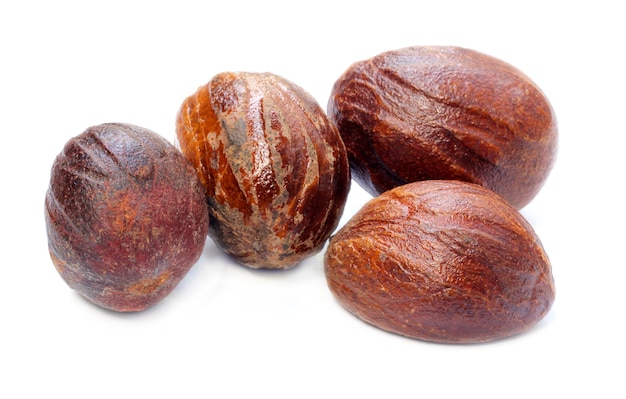 Fresh nutmeg or Jaifal Spice on white background