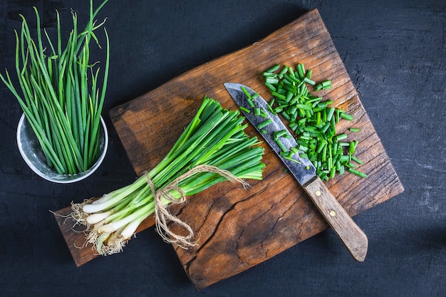 Fresh onion cut on wooden chopping board