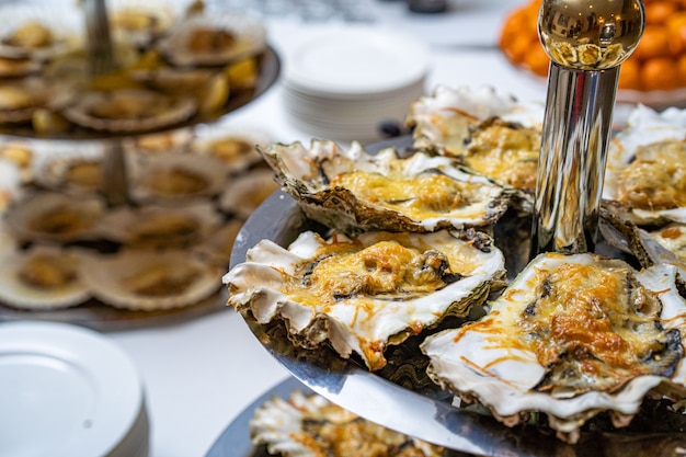 Fresh open oyster on a white plate. in the restaurant appetizer