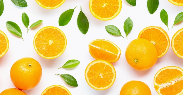 Fresh orange citrus fruit with leaves isolated on white background.