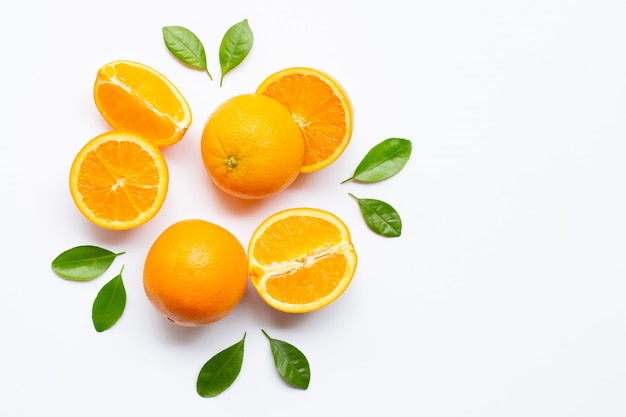 Fresh orange citrus fruit with leaves isolated on white background