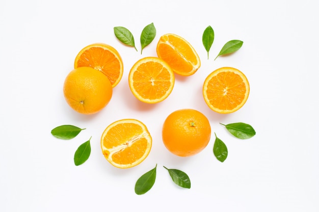 Fresh orange citrus fruit with leaves isolated on white.