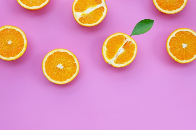 Fresh orange fruit on pink