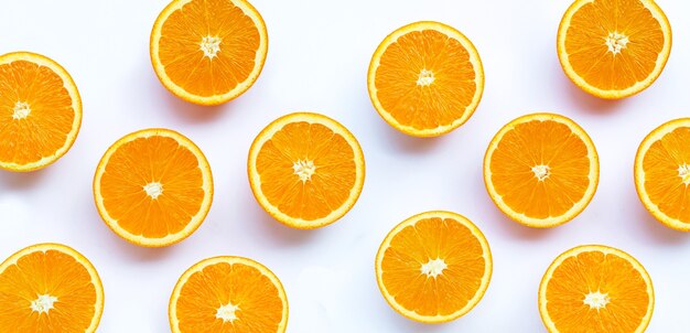 Fresh orange fruit on white table