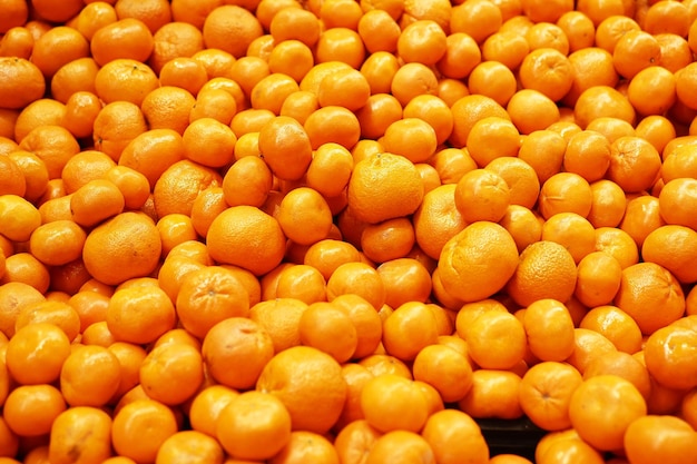 Fresh orange fruits display for sale at local market