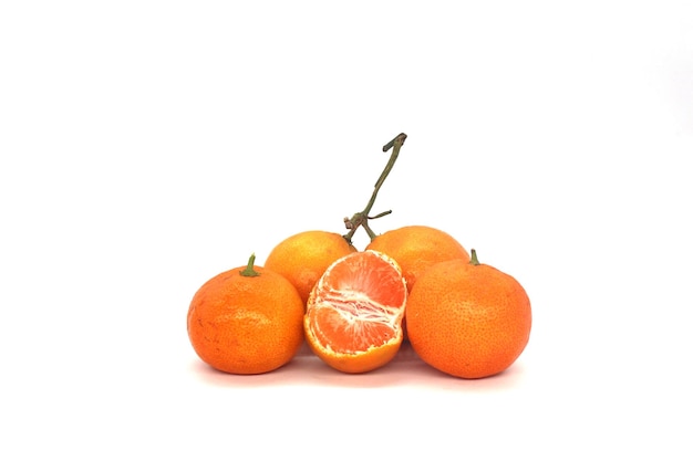 Fresh orange fruits isolated against a white background