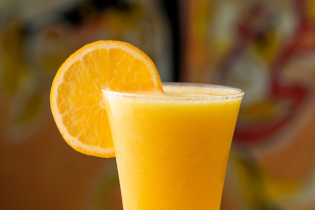 Fresh Orange Juice with raw slice served in disposable glass isolated on table top view arabian food