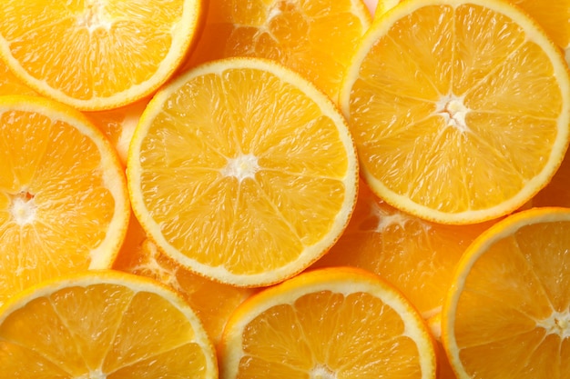 Fresh orange slices texture background, close up