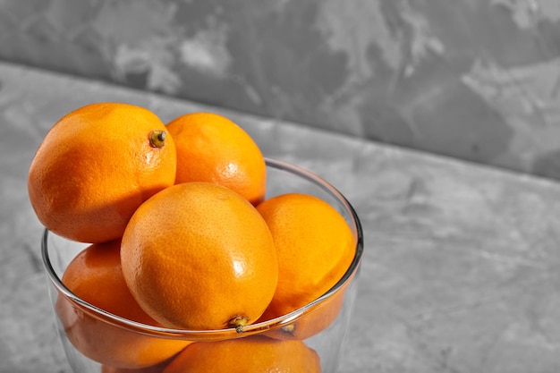 Fresh orange Tashkent lemons or Meyer lemons on concrete background Vitamin C