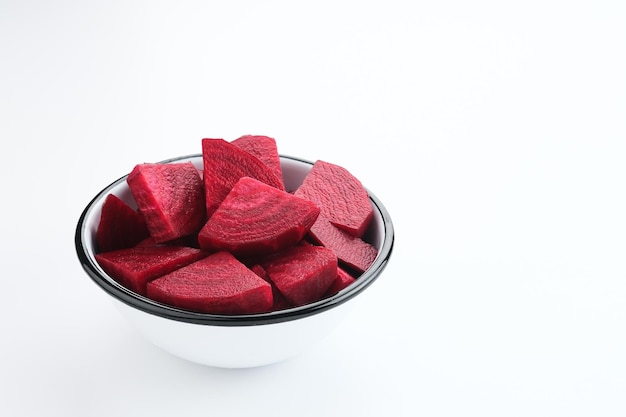 Fresh Organic Beetroot Slices served in a bowl on a white background.