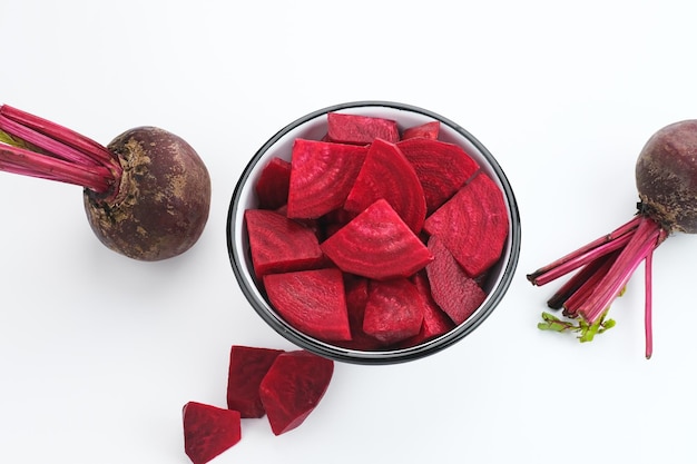 Fresh Organic Beetroot Slices served in a bowl on a white background.