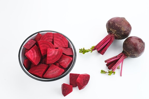 Fresh Organic Beetroot Slices served in a bowl on a white background.