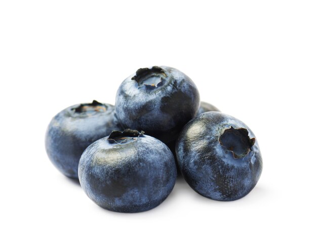 Fresh organic blueberries on a white surface