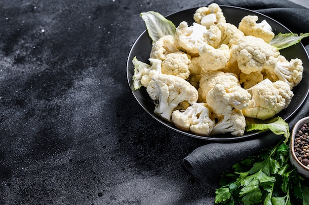 Fresh organic cauliflower cut into small pieces in bowl