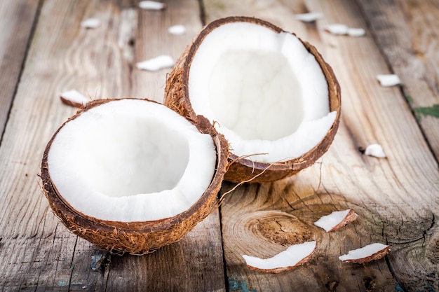 Fresh organic coconut on rustic wooden background