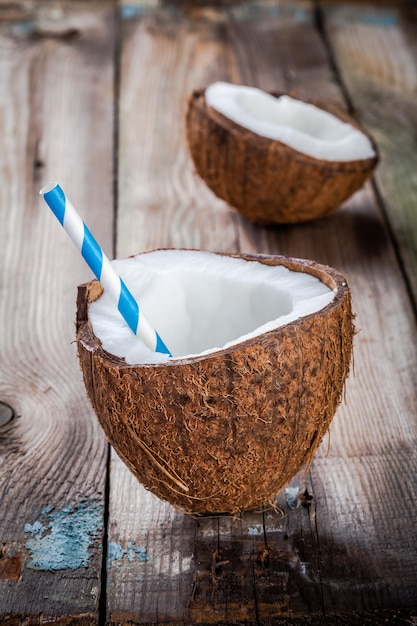 Fresh organic coconut on rustic wooden background