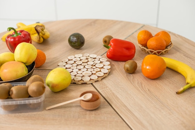 Fresh organic fruits and vegetables on wooden background.