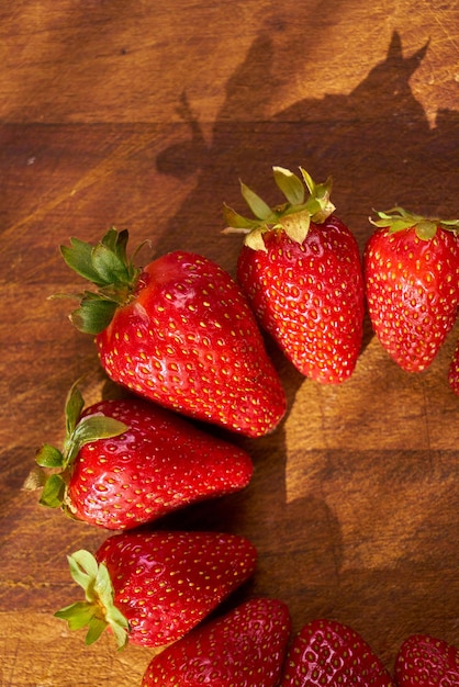 Fresh organic strawberries on a wooden cutting board Strawberry banner