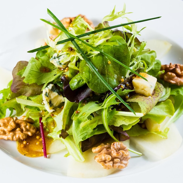 Fresh organic vegetable salad on whte plate