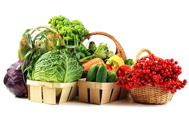 Fresh organic vegetables in wicker baskets close up