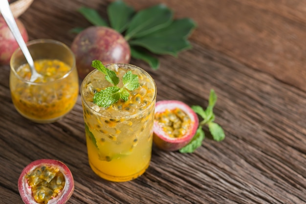 Fresh passion fruit with mint and soda water in glass, detox water, healthy drink.