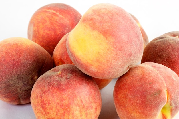 Fresh peaches isolated on white