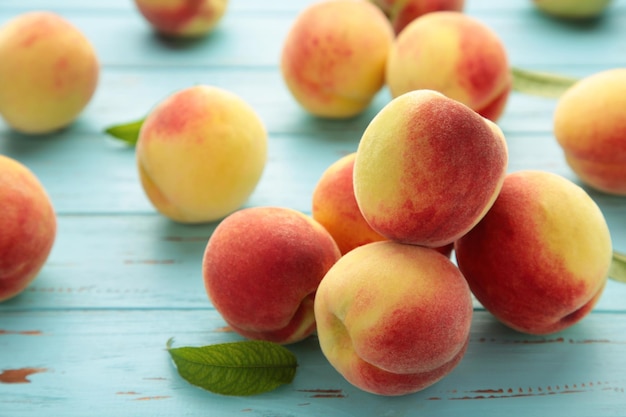 Fresh peaches on a old blue background Space for text