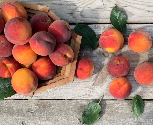 fresh peaches on wooden background